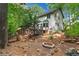Backyard features a deck and fire pit surrounded by beautiful landscaping at 200 Zachary Woods Nw Pt, Marietta, GA 30064