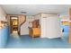 Unfinished basement area with blue flooring, white walls and a staircase to the upper level at 200 Zachary Woods Nw Pt, Marietta, GA 30064