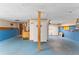 Unfinished basement shows open space with blue trim and exposed ceiling at 200 Zachary Woods Nw Pt, Marietta, GA 30064