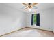 Well-lit carpeted bedroom featuring a ceiling fan and an exterior view out of the window at 200 Zachary Woods Nw Pt, Marietta, GA 30064