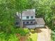 Traditional style home with a two car garage, front porch, and mature trees at 200 Zachary Woods Nw Pt, Marietta, GA 30064