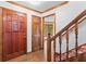 Bright foyer with wood floors, stairs, and a beautiful wooden front door with sidelight windows at 200 Zachary Woods Nw Pt, Marietta, GA 30064