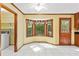 Bright kitchen featuring tile floors, a bay window, and a door to the outside at 200 Zachary Woods Nw Pt, Marietta, GA 30064