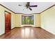 This bright living room features a bay window, wood trim and wood-look laminate floors at 200 Zachary Woods Nw Pt, Marietta, GA 30064