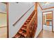 Carpeted staircase with wooden banister and trim, leading to the upper level of the home at 200 Zachary Woods Nw Pt, Marietta, GA 30064
