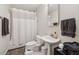 Neat bathroom with a pedestal sink and gray accent towels at 285 Glen Lake Dr, Atlanta, GA 30327