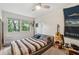 Cozy bedroom with a window view, stylish lighting, and unique wall decor at 285 Glen Lake Dr, Atlanta, GA 30327