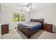 Bedroom featuring a dark wood bed set and window view at 285 Glen Lake Dr, Atlanta, GA 30327