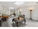 Open-concept living room with abundant natural light and unique decor and high ceilings at 285 Glen Lake Dr, Atlanta, GA 30327