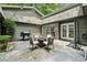Cozy patio area with outdoor seating, grill, and string lights for outdoor entertaining at 285 Glen Lake Dr, Atlanta, GA 30327