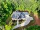 Aerial view of the beautiful brick home, landscaped grounds, and a curving concrete driveway at 338 Mount Zion Rd, Oxford, GA 30054