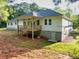 The back of the house showcases a deck and basement entrance at 338 Mount Zion Rd, Oxford, GA 30054