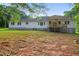 Backyard view of the house with a covered porch, blending indoor and outdoor living at 338 Mount Zion Rd, Oxford, GA 30054