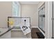 Bright bathroom featuring a soaking tub with marble surround and a glass-enclosed shower at 338 Mount Zion Rd, Oxford, GA 30054