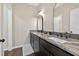Bathroom with dark wood cabinetry, granite countertop, and modern light fixtures at 338 Mount Zion Rd, Oxford, GA 30054