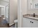 This bathroom features a granite countertop and a shower and tub combo with a gray accent rug at 338 Mount Zion Rd, Oxford, GA 30054