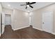 Spacious bedroom featuring dark wood floors and multiple doors at 338 Mount Zion Rd, Oxford, GA 30054