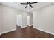 This bedroom features wood floors and doorways to a bathroom at 338 Mount Zion Rd, Oxford, GA 30054