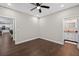 This bedroom features wood floors and doorways to the bathroom and kitchen areas at 338 Mount Zion Rd, Oxford, GA 30054