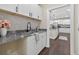 Butler's pantry with stainless steel sink, granite counter, and white cabinetry at 338 Mount Zion Rd, Oxford, GA 30054