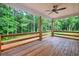 Cozy covered porch with wood railings, offering a serene view of the surrounding nature at 338 Mount Zion Rd, Oxford, GA 30054