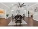 Dining area features modern lighting, hardwood floors, neutral paint, and decorative trim at 338 Mount Zion Rd, Oxford, GA 30054