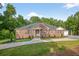 Stunning brick home with manicured lawn and extended driveway, showcasing elegance and functionality at 338 Mount Zion Rd, Oxford, GA 30054