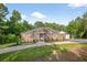 Lovely brick house with a green lawn and fresh landscaping, offering a welcoming and picturesque view at 338 Mount Zion Rd, Oxford, GA 30054