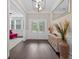 Inviting foyer with dark wood floors, a console table, and a view of the entry doors at 338 Mount Zion Rd, Oxford, GA 30054