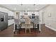 Modern kitchen with white cabinets, granite countertops, stainless steel appliances, and bar seating at 338 Mount Zion Rd, Oxford, GA 30054