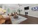 Spacious living room with hardwood floors, fireplace, and neutral decor at 338 Mount Zion Rd, Oxford, GA 30054