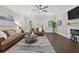 Bright living room with hardwood floors, a modern fireplace, and access to the outdoor space at 338 Mount Zion Rd, Oxford, GA 30054
