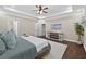 Bright main bedroom with tray ceiling, hardwood floors, and access to walk in closet and en suite at 338 Mount Zion Rd, Oxford, GA 30054