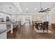 Open-concept layout with kitchen, dining area, and hardwood floors throughout the main living space at 338 Mount Zion Rd, Oxford, GA 30054