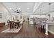 Spacious open floor plan with a dining table, kitchen island, and stainless steel appliances at 338 Mount Zion Rd, Oxford, GA 30054