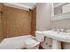 Bathroom with tiled shower-tub combo, a pedestal sink, and neutral wall color at 3655 Habersham Ne Rd # B-254, Atlanta, GA 30305