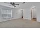 Bedroom with neutral carpet, ceiling fan, and natural light from windows at 3655 Habersham Ne Rd # B-254, Atlanta, GA 30305