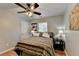 Comfortable bedroom offers natural light, wood floors, and decorative wall art at 4562 Lucerne Valley Sw Rd, Lilburn, GA 30047