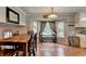 Bright breakfast nook with hardwood floors and large windows for a light filled room at 4562 Lucerne Valley Sw Rd, Lilburn, GA 30047