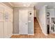 Welcoming entryway with hardwood floors, natural light and staircase at 4562 Lucerne Valley Sw Rd, Lilburn, GA 30047