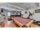 Entertaining game room with billiard table, exercise equipment, and comfortable seating at 4562 Lucerne Valley Sw Rd, Lilburn, GA 30047