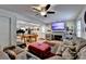 Open-concept living room with a billiard table, fireplace, and comfortable seating area at 4562 Lucerne Valley Sw Rd, Lilburn, GA 30047