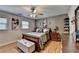 Comfortable main bedroom with decorative artwork and ample closet space at 4562 Lucerne Valley Sw Rd, Lilburn, GA 30047