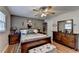 Well-appointed main bedroom with a plush bed, dresser, and stylish decor at 4562 Lucerne Valley Sw Rd, Lilburn, GA 30047