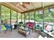 Inviting screened porch with comfortable seating and views of the lush backyard at 4562 Lucerne Valley Sw Rd, Lilburn, GA 30047