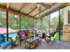 Relaxing screened porch boasts views of the outdoor pool and private yard at 4562 Lucerne Valley Sw Rd, Lilburn, GA 30047