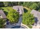 Beautiful aerial view of a home with a well-maintained lawn and mature trees in a tranquil neighborhood at 601 Laurel Xing, Canton, GA 30114