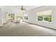 Bright bonus room featuring neutral walls, a ceiling fan, and access to the outside at 601 Laurel Xing, Canton, GA 30114