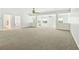 Spacious room offering lots of natural light through many windows and a ceiling fan at 601 Laurel Xing, Canton, GA 30114