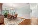 Formal dining room with a classic chandelier, wood furniture, and detailed trim at 601 Laurel Xing, Canton, GA 30114